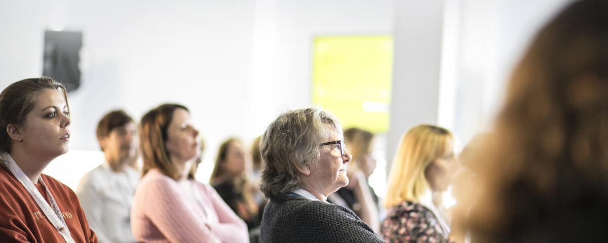 Audience clapping at the annual conference | the society of tissue viability