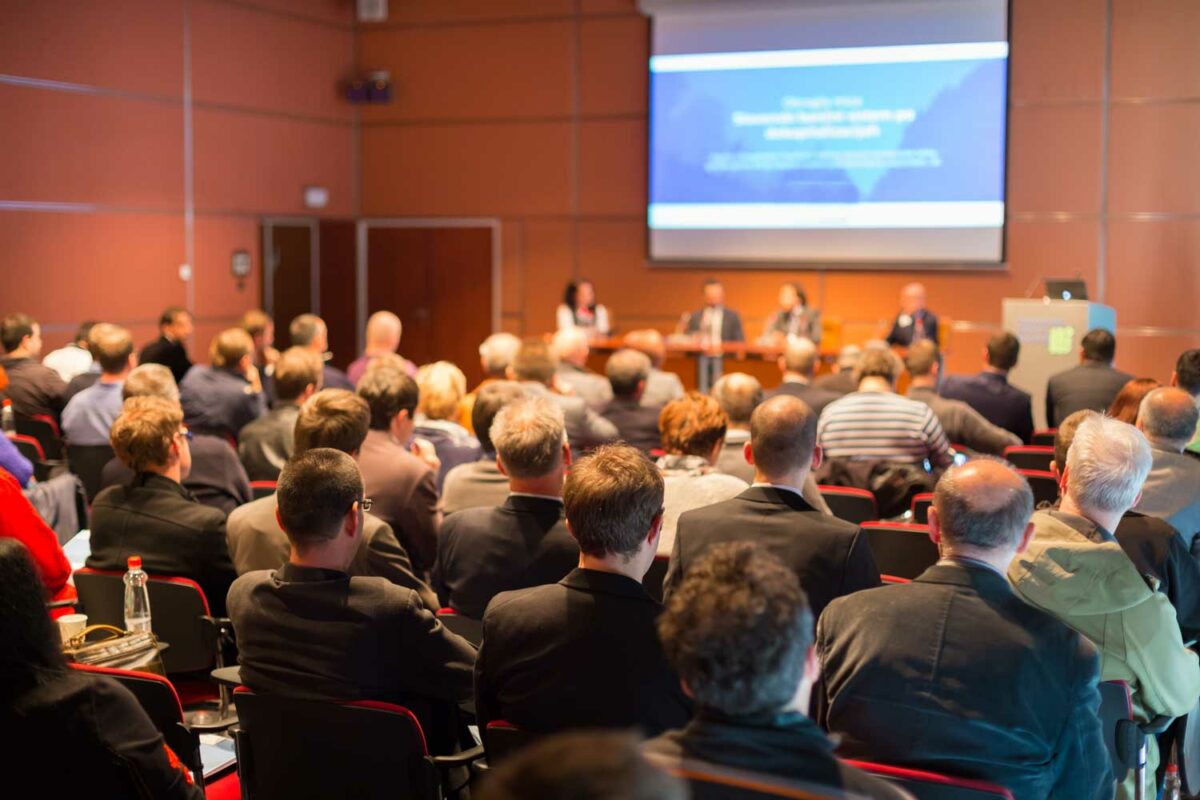 People in a conference room at a Society of Tissue Viability event