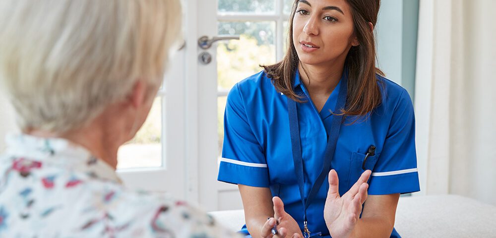 Nurse talking to patient